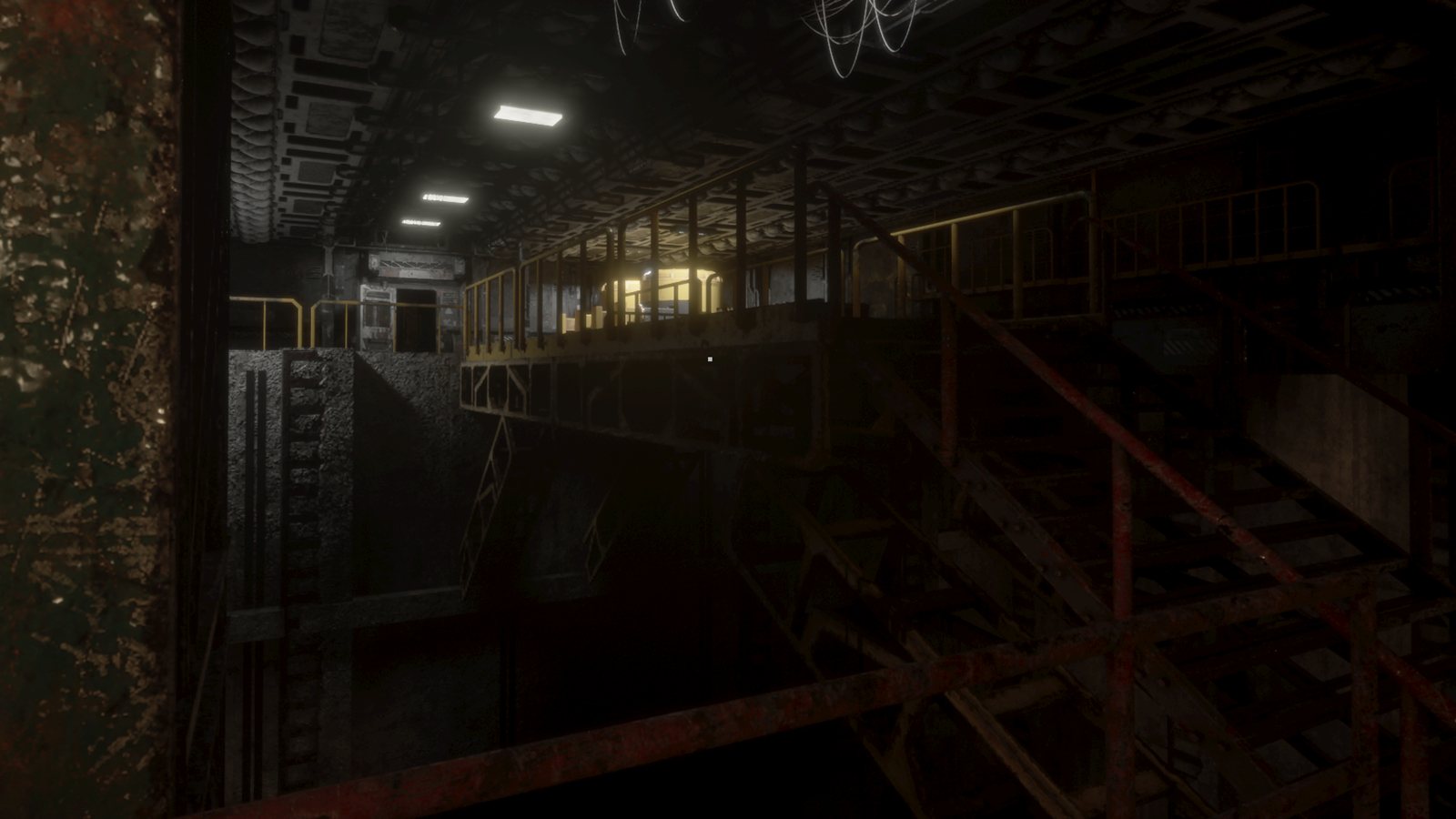 A single powered compartment glowing across the dark sub-deck catwalks